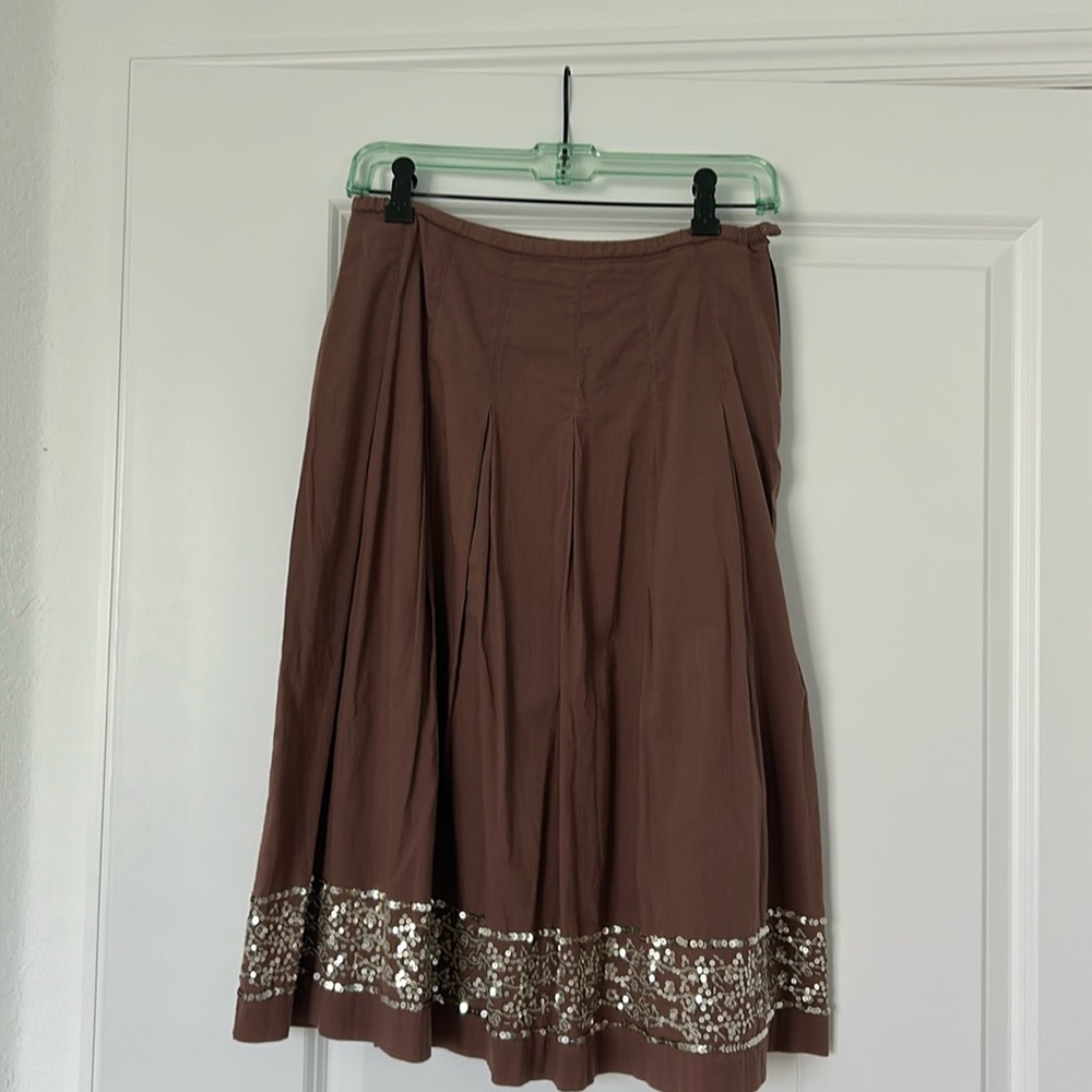 Chocolate brown dirndl skirt with sequined trim.